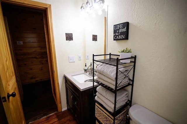 78 Lionfish Rd, Broken Bow, OK 74728 - half bath with wood finished floors, toilet, and vanity
