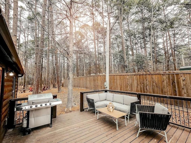 78 Lionfish Rd, Broken Bow, OK 74728 - wooden deck with an outdoor living space, fence, a grill, and view of scattered trees
