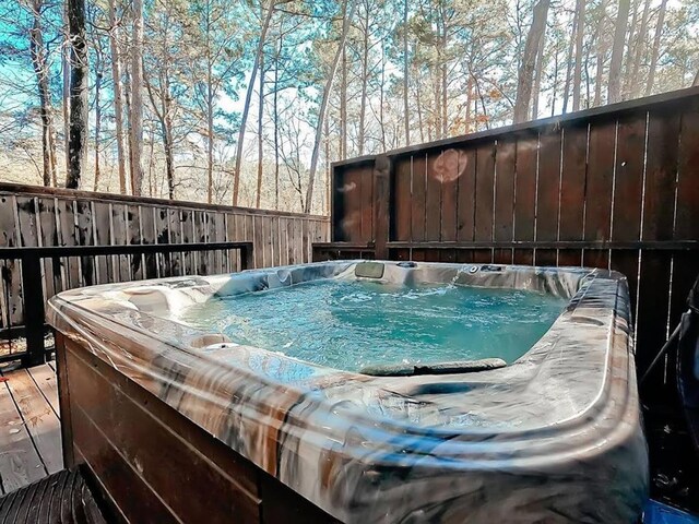 78 Lionfish Rd, Broken Bow, OK 74728 - deck featuring a hot tub and fence