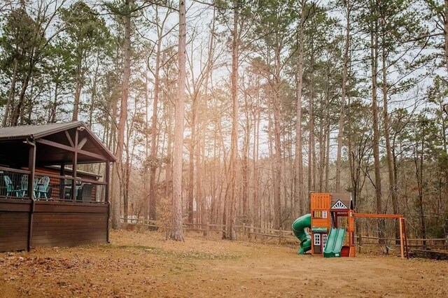 78 Lionfish Rd, Broken Bow, OK 74728 - view of yard featuring a playground, a view of trees, and fence