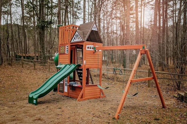 78 Lionfish Rd, Broken Bow, OK 74728 - view of jungle gym featuring view of wooded area