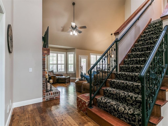 404 Nantucket Blvd, Norman, OK 73071 - stairway featuring baseboards, ceiling fan, wood finished floors, and high vaulted ceiling