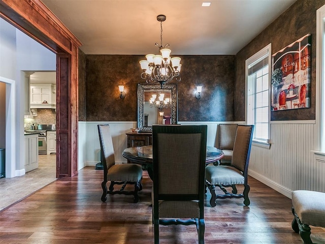 404 Nantucket Blvd, Norman, OK 73071 - dining area with a chandelier, wood finished floors, and wainscoting