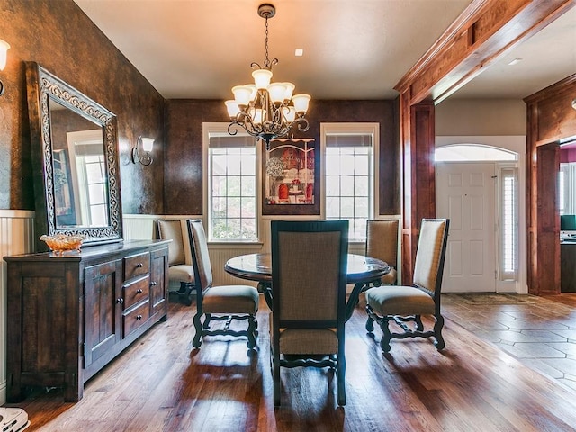 404 Nantucket Blvd, Norman, OK 73071 - dining space with wainscoting, a chandelier, and wood finished floors
