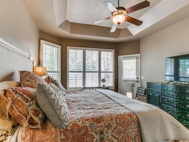 404 Nantucket Blvd, Norman, OK 73071 - bedroom featuring ceiling fan and a tray ceiling
