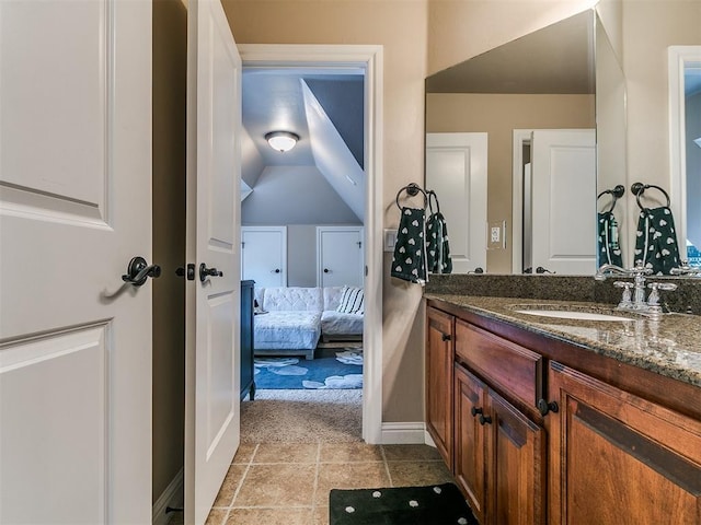 404 Nantucket Blvd, Norman, OK 73071 - ensuite bathroom with vanity, baseboards, and tile patterned flooring