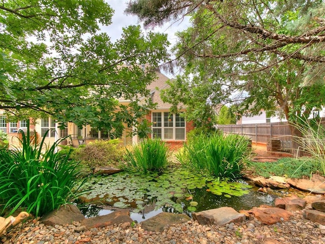 404 Nantucket Blvd, Norman, OK 73071 - view of yard with a garden pond