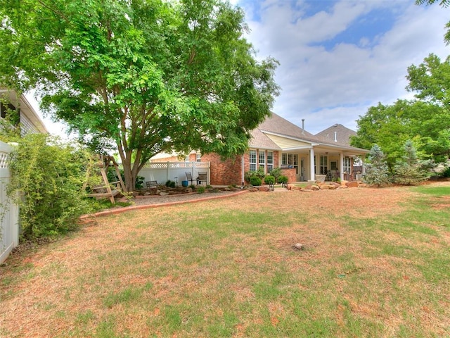 404 Nantucket Blvd, Norman, OK 73071 - view of grassy yard featuring a porch