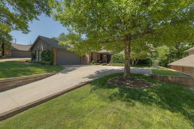 obstructed view of property with concrete driveway, a front yard, an attached garage, and brick siding