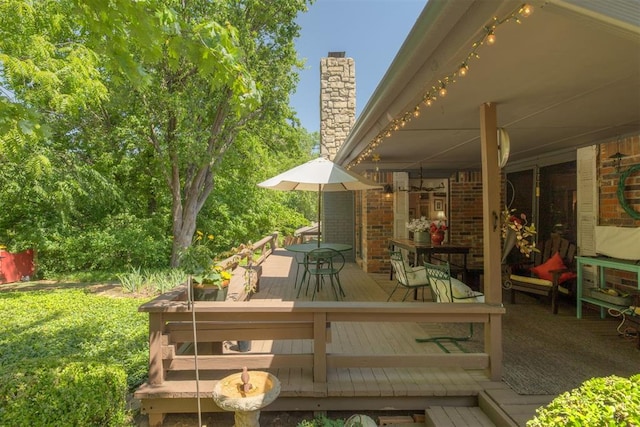 wooden deck with outdoor dining area