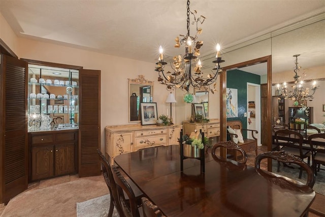 dining space with a chandelier