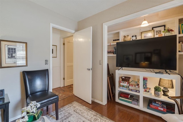 sitting room featuring wood finished floors and baseboards