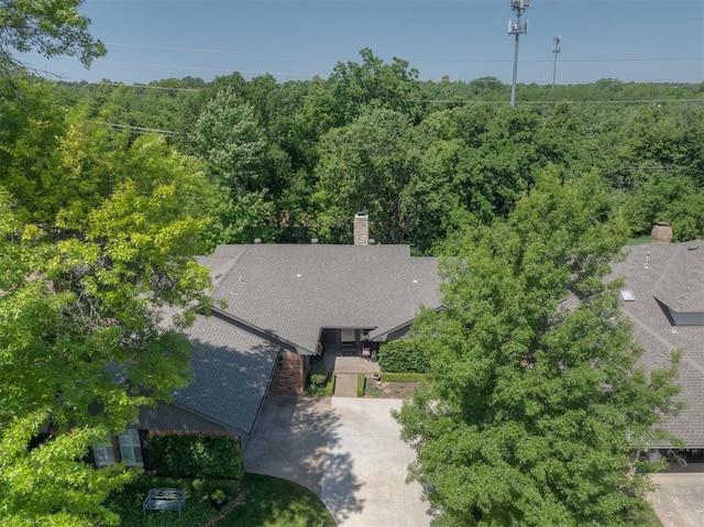 view from above of property with a forest