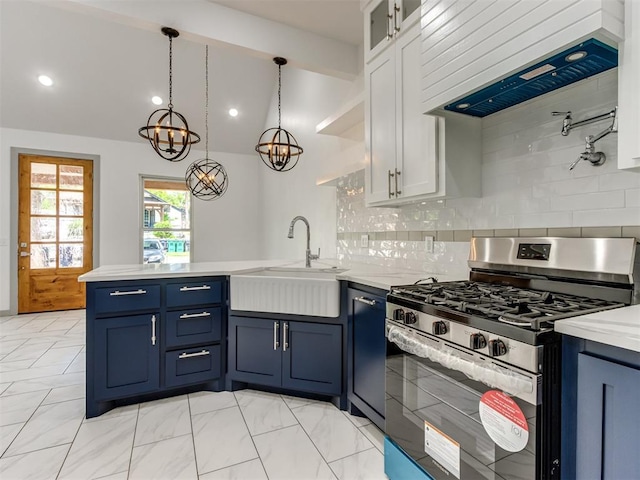 1518 NW 8th St, Oklahoma City, OK 73106 - kitchen with stainless steel range with gas cooktop, a sink, a peninsula, custom range hood, and decorative backsplash