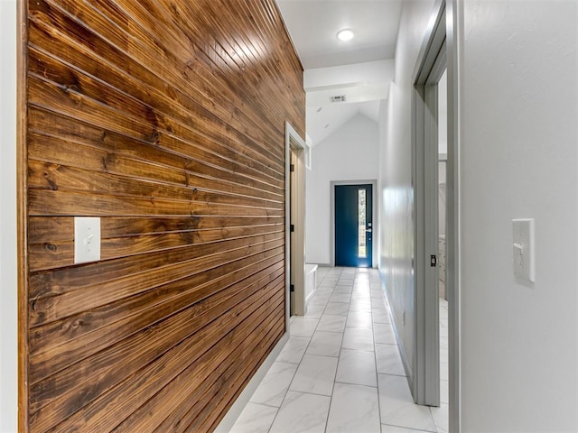1518 NW 8th St, Oklahoma City, OK 73106 - corridor featuring wooden walls, light marble finish flooring, and vaulted ceiling