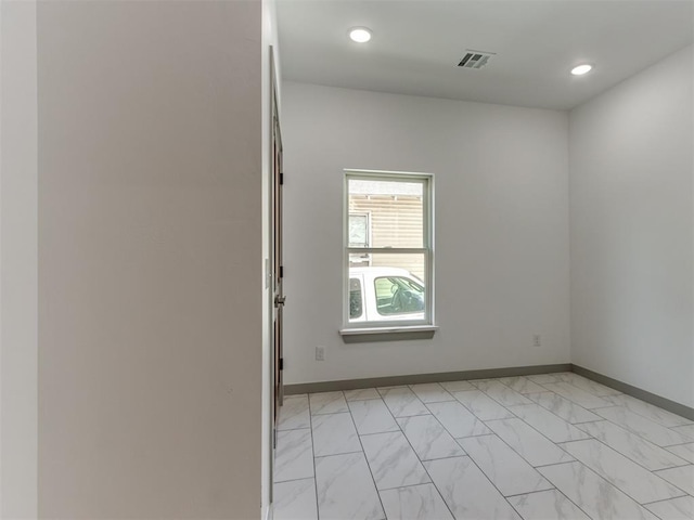 1518 NW 8th St, Oklahoma City, OK 73106 - unfurnished room with light marble finish floors, recessed lighting, and baseboards
