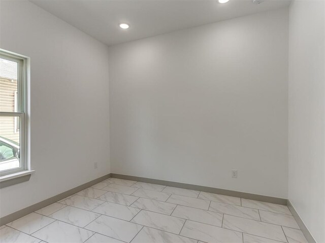 1518 NW 8th St, Oklahoma City, OK 73106 - unfurnished room featuring light marble finish flooring, baseboards, and recessed lighting