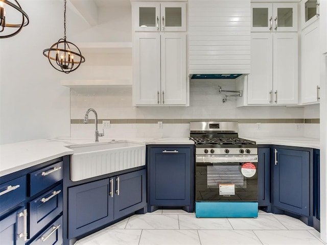 1518 NW 8th St, Oklahoma City, OK 73106 - kitchen with stainless steel gas range, blue cabinets, a sink, and white cabinets