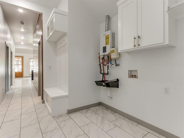 1518 NW 8th St, Oklahoma City, OK 73106 - mudroom featuring baseboards, light marble finish flooring, recessed lighting, and water heater