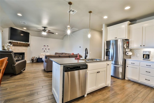 1425 NW 12th St, Newcastle, OK 73065 - kitchen with appliances with stainless steel finishes, lofted ceiling, open floor plan, a sink, and ceiling fan