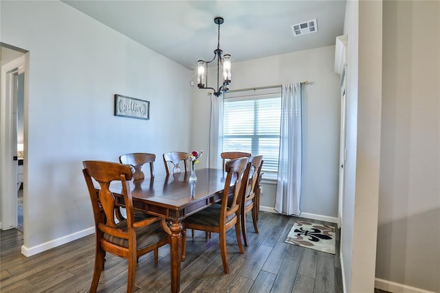 1425 NW 12th St, Newcastle, OK 73065 - dining room with baseboards, a chandelier, and dark wood finished floors