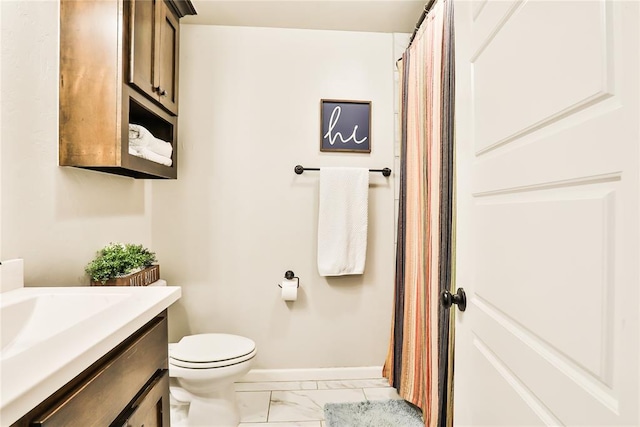 1425 NW 12th St, Newcastle, OK 73065 - full bathroom with marble look tiles, toilet, baseboards, vanity, and a shower with shower curtain
