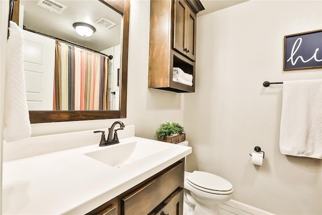 1425 NW 12th St, Newcastle, OK 73065 - bathroom with toilet, vanity, baseboards, and curtained shower