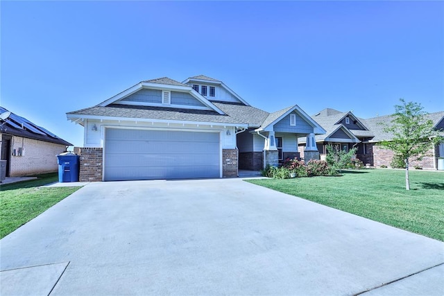 1425 NW 12th St, Newcastle, OK 73065 - view of front facade with concrete driveway, a front lawn, brick siding, and an attached garage