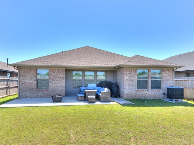 8701 Ricard Dr, Oklahoma City, OK 73135 - back of property featuring central AC, a patio, brick siding, an outdoor living space with a fire pit, and a shingled roof