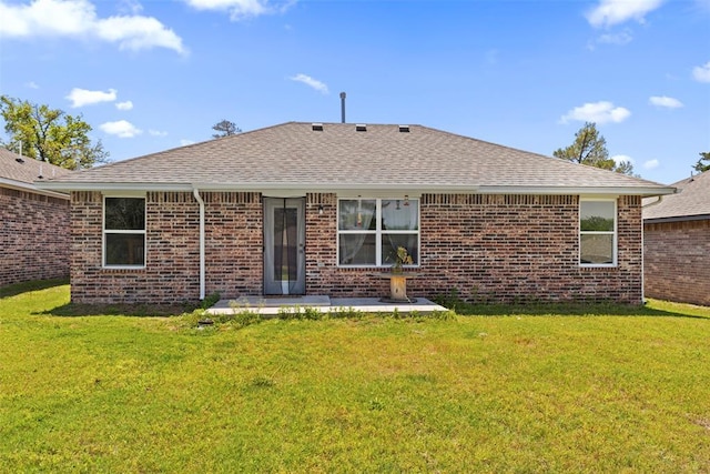12509 NE 36th Sts, Spencer, OK 73084 - back of property featuring roof with shingles, a lawn, and brick siding