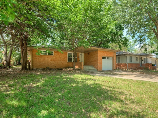 ranch-style house featuring brick siding, an attached garage, a front lawn, and concrete driveway