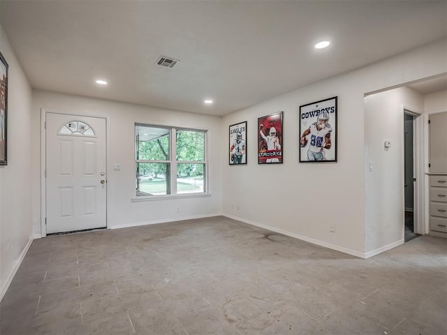 foyer with baseboards and recessed lighting