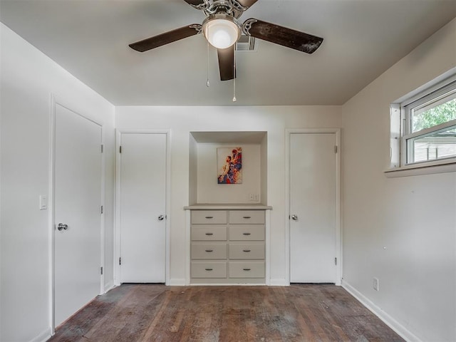 unfurnished bedroom featuring wood finished floors, ceiling fan, and baseboards