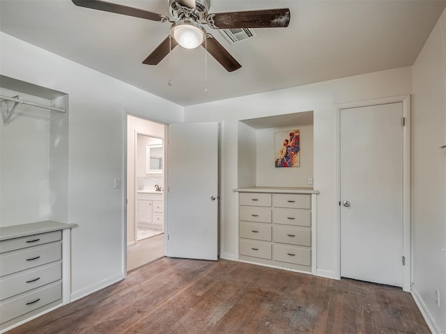 unfurnished bedroom with wood finished floors and ceiling fan