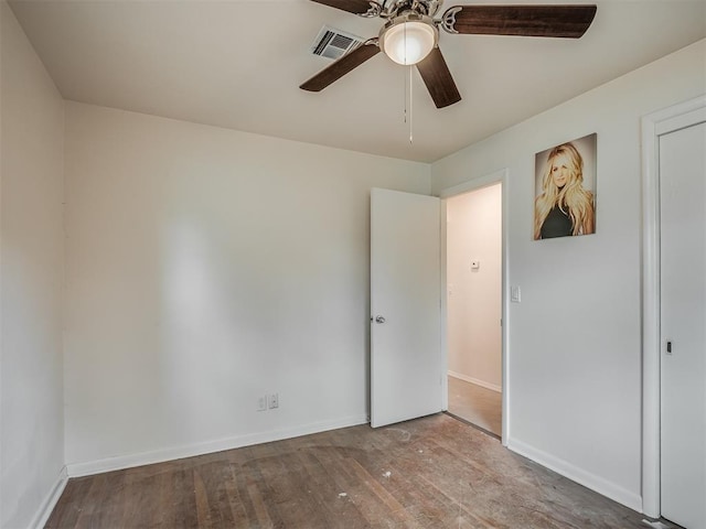 unfurnished bedroom featuring wood finished floors, baseboards, and ceiling fan