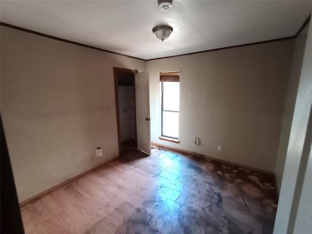 11209 Cimarron Dr, Oklahoma City, OK 73162 - spare room featuring ornamental molding, a smoke detector, and light wood finished floors