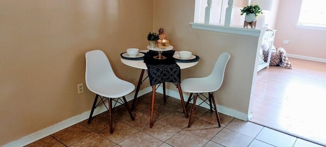 tiled dining area with baseboards