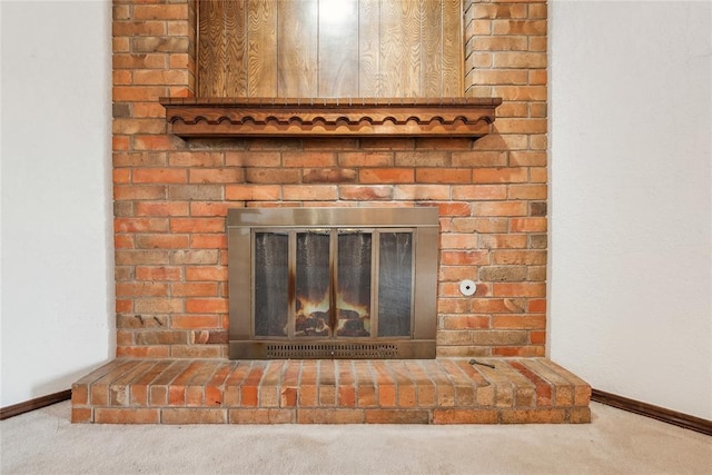 3109 N Glade Ave, Bethany, OK 73008 - detailed view of a brick fireplace, carpet floors, and baseboards