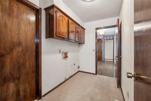 3109 N Glade Ave, Bethany, OK 73008 - washroom with light carpet, washer hookup, a textured ceiling, cabinet space, and baseboards