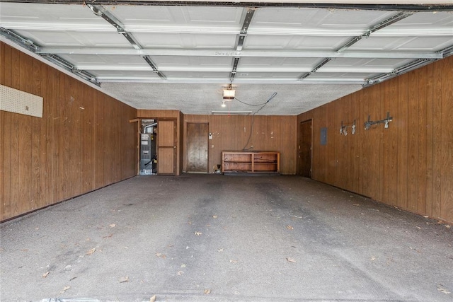 3109 N Glade Ave, Bethany, OK 73008 - garage with a garage door opener and wood walls