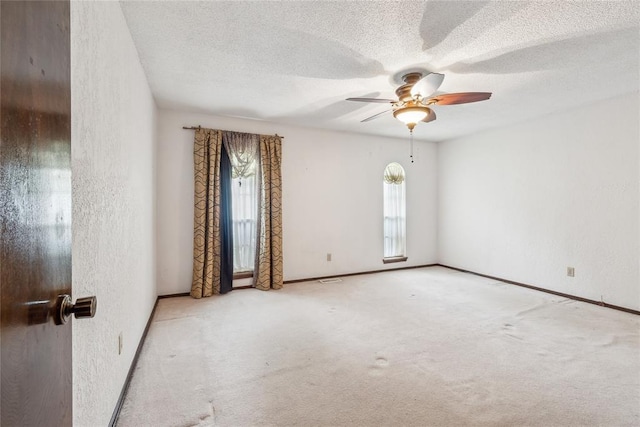 3109 N Glade Ave, Bethany, OK 73008 - unfurnished room with a ceiling fan, carpet flooring, a textured ceiling, a textured wall, and baseboards