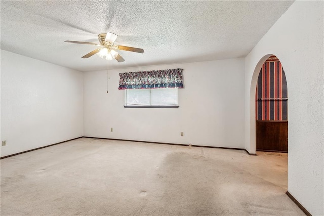 3109 N Glade Ave, Bethany, OK 73008 - empty room with ceiling fan, a textured ceiling, carpet, and baseboards