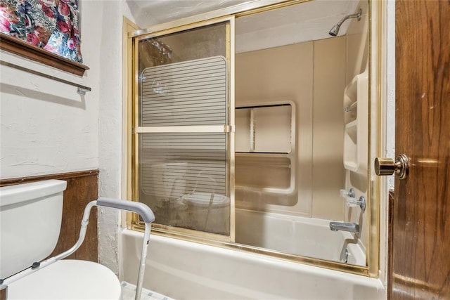 3109 N Glade Ave, Bethany, OK 73008 - full bath featuring toilet, shower / bath combination with glass door, and a textured wall