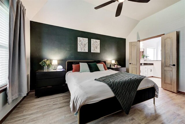17009 Picasso Dr, Oklahoma City, OK 73170 - bedroom featuring vaulted ceiling, light wood-style floors, an accent wall, a ceiling fan, and baseboards