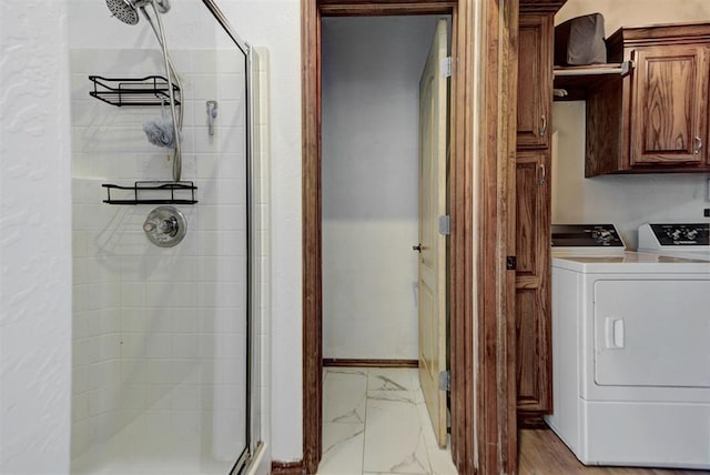 17009 Picasso Dr, Oklahoma City, OK 73170 - laundry area with washing machine and clothes dryer and light marble finish floors