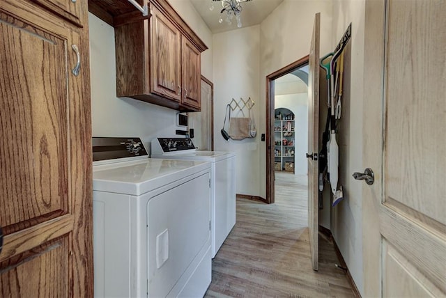 17009 Picasso Dr, Oklahoma City, OK 73170 - washroom featuring cabinet space, washing machine and dryer, light wood finished floors, and baseboards