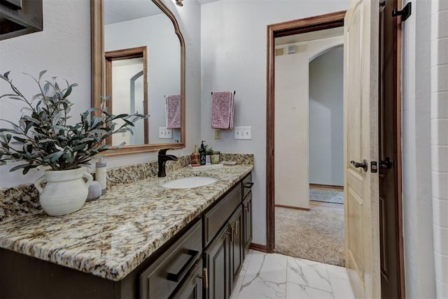 17009 Picasso Dr, Oklahoma City, OK 73170 - bathroom with vanity, baseboards, and marble look tile flooring