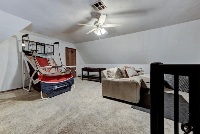 17009 Picasso Dr, Oklahoma City, OK 73170 - carpeted living room featuring a ceiling fan and vaulted ceiling