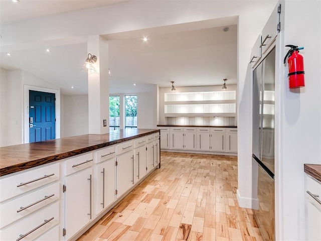 kitchen with white cabinetry, light wood finished floors, recessed lighting, and wooden counters