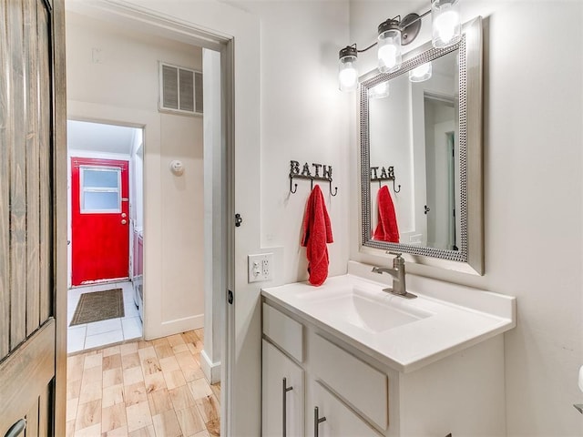 bathroom with vanity and baseboards